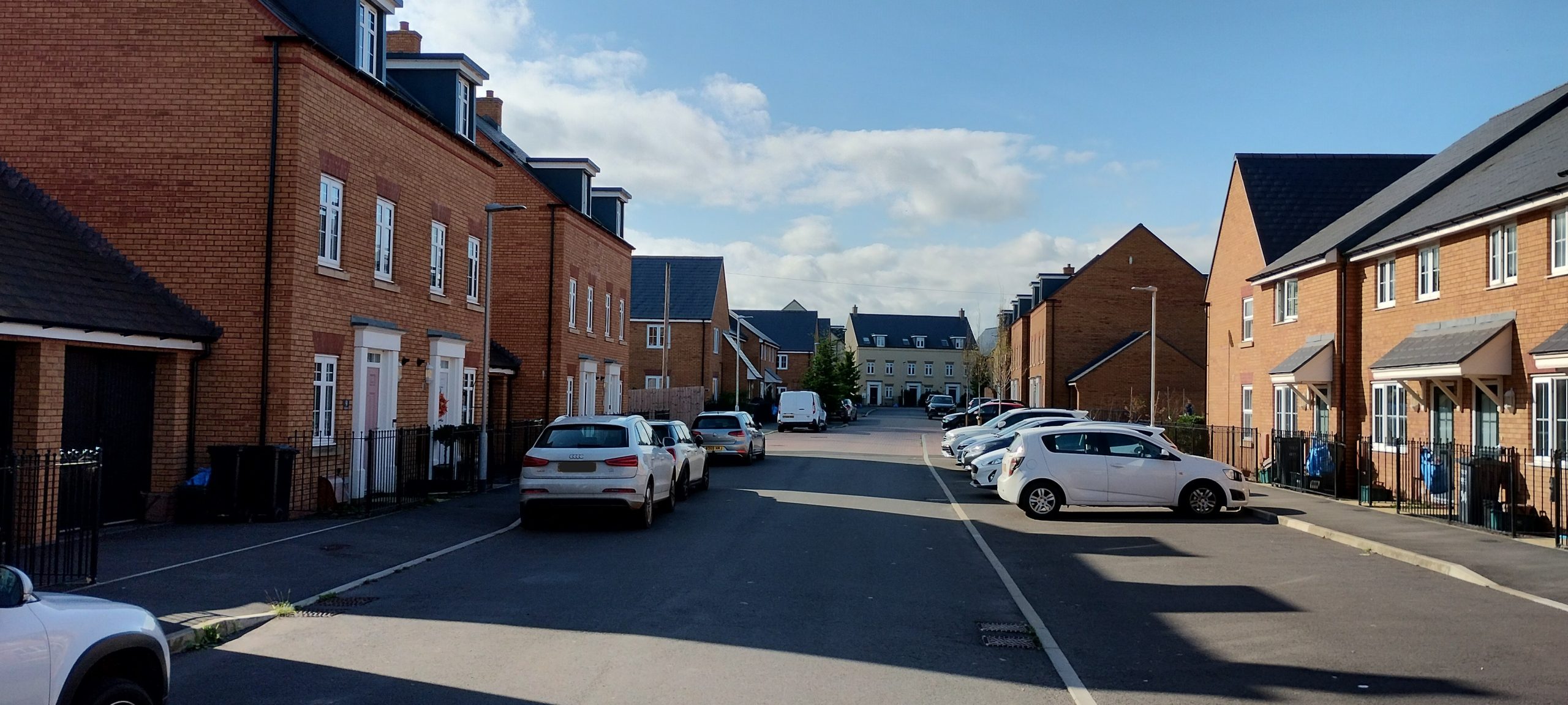 Cars parked in front of houses